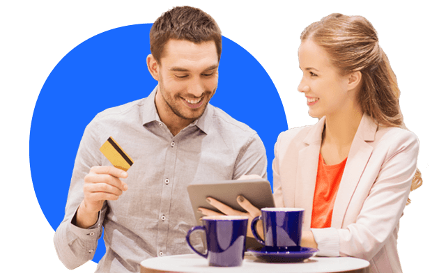 Smiling couple complete an online payment