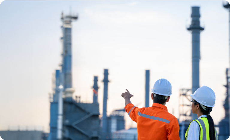 Two field workers at an energy facility